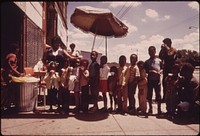 Ghetto Black Children Line Up For Snow Cones From A Sidewalk Vendor On Chicago's West Side In The Summer Of 1973, 06/1973. Photographer: White, John H. Original public domain image from Flickr