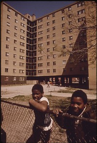 Black Youngsters Outside The Stateway Gardens Highrise Housing Project On Chicago's South Side, 05/1973. Photographer: White, John H. Original public domain image from Flickr