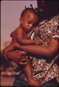 A South Side Chicago Ghetto Mother And Child Who Live In Nearby Low Income Housing, 06/1973. Photographer: White, John H. Original public domain image from Flickr