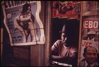 Black Man Operating A Newsstand In Chicago On The West Side The City Is Believed To Be The Black Business Capital Of The United States, 06/1973. Photographer: White, John H. Original public domain image from Flickr