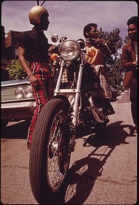 Black Residents Of Chicago's West Side Check Out A Motorcycle. The City's West Side Did Not Quickly Recover From The Riots And Fires Of The Mid And Late 1960's, 06/1973. Photographer: White, John H. Original public domain image from Flickr