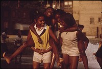 Black Youngsters Cool Off With Fire Hydrant Water On Chicago's South Side In The Woodlawn Community, 06/1973. Photographer: White, John H. Original public domain image from Flickr