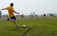 U.S. Sailors and members of the Malaysian Armed Forces play soccer during a sports day event in Kuantan, Malaysia, June 22, 2013, as part of Cooperation Afloat Readiness and Training (CARAT) 2013.