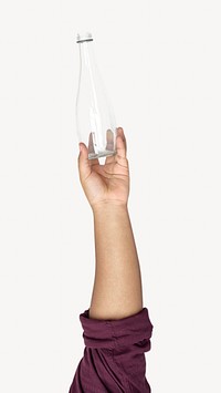 Recyclable plastic bottle, volunteer holding up trash