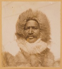 Matthew Alexander Henson, head-and-shoulders portrait, facing front, wearing his fur suit. 