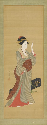 A geisha about to adjust a tortoise-shell hairpin