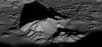 Tycho crater's central peak complex casts a long, dark shadow near local sunrise in this spectacular lunar-scape. The dramatic oblique view was recorded by the Lunar Reconnaissance Orbiter. The rugged complex is about 15 kilometres wide, formed in uplift by the giant impact that created the well-known ray crater 100 million years ago. The summit of its central peak reaches 2 kilometres above the Tycho crater floor.