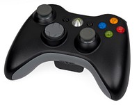 A black wireless Xbox 360 controller.