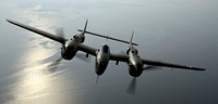 OVER VIRGINIA -- Steve Hinton flies "Glacier Girl," a P-38 Lightning dug out from 268 feet of ice in eastern Greenland in 1992. The aircraft was part of a heritage flight during an air show at Langley Air Force Base, Va., on May 21. (U.S. Air Force photo by Tech. Sgt. Ben Bloker)