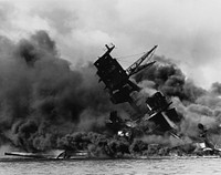 The USS Arizona (BB-39) burning after the Japanese attack on Pearl Harbor, 7 December 1941. USS Arizona sunk at en:Pearl Harbor. The ship is resting on the harbor bottom. The supporting structure of the forward tripod mast has collapsed after the forward magazine exploded.