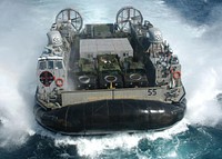 LCAC-55, a Navy Landing Craft Air Cushion (LCAC), maneuvers to enter the well deck of the amphibious assault ship USS Kearsarge (LHD-3). Kearsarge and the embarked 26th Marine Expeditionary Unit (Special Operations Capable) are conducting Maritime Security Operations in the Persian Gulf. The Landing Craft Air Cushion, more commonly known as an LCAC, is assigned to Assault Craft Unit 4 from Naval Amphibious Base Little Creek in Norfolk, Va.