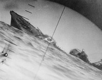 Sinking of the Japanese destroyer Yamakaze on 25 June 1942 approximately 110 km southeast of Yokosuku, Japan, photographed through the periscope of the U.S. Navy submarine USS Nautilus (SS-168). This position is given in The Official Chronology of the U.S. Navy in World War II by Robert Cressman. NH 111751 says 75 miles southwest of Yokahama Harbor. Yokahama is near Yokosuku.