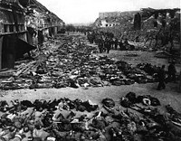 Aftermath of the British bombing raid of 3 and 4 April 1945 that destroyed the Boelcke-Kaserne (Boelcke Barracks) located in the south-east of the town of Nordhausen and killed around 1300 inmates. The barracks was a subcamp of the Mittelbau-Dora Nazi concentration camp. Used as an overflow camp for sick and dying inmates from January 1945, numbers rose from a few hundred to over 6000, and the conditions saw up to 100 inmates die every day. The camp was named after Oswald Boelke.