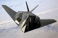 A US Air Force (USAF) F-117A Nighthawk Stealth Fighter aircraft flies over Nellis Air Force Base (AFB), Nevada (NV), during the joint service experimentation process dubbed Millennium Challenge 2002 (MC02). Sponsored by the US Joint Forces Command (USJFCOM), the MC02 experiment explores how Effects Based Operations (EBO) can provide an integrated joint context for conducting rapid, decisive operations (RDO).