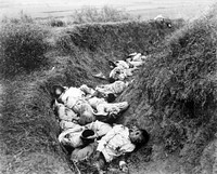 Filipino casualties on the first day of the Philippine-American War. Original caption is 'Insurgent dead just as they fell in the trench near Santa Ana, February 5th. The trench was circular, and the picture shows but a small portion.'