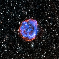 X-ray & Optical Images of SNR E0519-69.0 - When a massive star exploded in the Large Magellanic Cloud, a satellite galaxy to the Milky Way, it left behind an expanding shell of debris called SNR 0519-69.0. Here, multimillion degree gas is seen in X-rays from Chandra (blue). The outer edge of the explosion (red) and stars in the field of view are seen in visible light from Hubble.