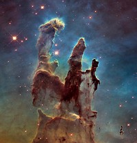 NASA's Hubble Space Telescope has revisited the famous Pillars of Creation, originally photographed in 1995, revealing a sharper and wider view of the structures in this visible-light image.Astronomers combined several Hubble exposures to assemble the wider view. The towering pillars are about 5 light-years tall. The dark, finger-like feature at bottom right may be a smaller version of the giant pillars. The new image was taken with Hubble's versatile and sharp-eyed Wide Field Camera 3.The pillars are bathed in the blistering ultraviolet light from a grouping of young, massive stars located off the top of the image. Streamers of gas can be seen bleeding off the pillars as the intense radiation heats and evaporates it into space. Denser regions of the pillars are shadowing material beneath them from the powerful radiation. Stars are being born deep inside the pillars, which are made of cold hydrogen gas laced with dust. The pillars are part of a small region of the Eagle Nebula, a vast star-forming region 6,500 light-years from Earth.The colors in the image highlight emission from several chemical elements. Oxygen emission is blue, sulfur is orange, and hydrogen and nitrogen are green.A number of Herbig-Haro jets lengthened noticeably (see lower panel of linked page) in the nearly 20-year interval between the two Hubble images.Object Names: M16, Eagle Nebula, NGC 6611A longer news release is linked here.The original image was edited to reduce noise.