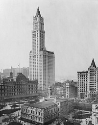 View of Woolworth Building and surrounding buildings, New York City. Mullet's City Hall Post Office and Courthouse (New York City) in middleground left.