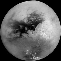 A mosaic of nine processed images acquired during Cassini's first very close flyby of Saturn's moon Titan on Oct. 26, 2004, constitutes the most detailed full-disc view of the mysterious moon. The view is centered on 15 degrees South latitude, and 156 degrees West longitude. Brightness variations across the surface and bright clouds near the south pole are easily seen. The images that comprise the mosaic have been processed to reduce the effects of the atmosphere and to sharpen surface features. The mosaic has been trimmed to show only the illuminated surface and not the atmosphere above the edge of the moon. The Sun was behind Cassini so nearly the full disc is illuminated. Pixels scales of the composite images vary from 2 to 4 kilometers per pixel (1.2 to 2.5 miles per pixel). Surface features are best seen near the center of the disc, where the spacecraft is looking directly downwards; the contrast becomes progressively lower and surface features become fuzzier towards the outside, where the spacecraft is peering through haze, a circumstance that washes out surface features. The brighter region on the right side and equatorial region is named Xanadu Regio. Scientists are actively debating what processes may have created the bizarre surface brightness patterns seen here. The images hint at a young surface with no obvious craters. However, the exact nature of that activity, whether tectonic, wind-blown, fluvial, marine, or volcanic is still to be determined. The images comprising this mosaic were acquired from distances ranging from 650,000 kilometers (400,000 miles) to 300,000 kilometers (200,000 miles).