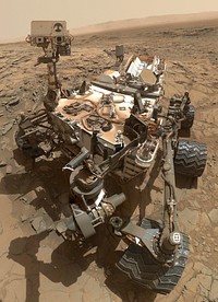 This self-portrait of NASA's Curiosity Mars rover shows the vehicle at the "Big Sky" site, where its drill collected the mission's fifth taste of Mount Sharp.The scene combines dozens of images taken during the 1,126th Martian day, or sol, of Curiosity's work during Mars (Oct. 6, 2015, PDT), by the Mars Hand Lens Imager (MAHLI) camera at the end of the rover's robotic arm. The rock drilled at this site is sandstone in the Stimson geological unit inside Gale Crater.The view is centered toward the west-northwest. It does not include the rover's robotic arm, though the shadow of the arm is visible on the ground. Wrist motions and turret rotations on the arm allowed MAHLI to acquire the mosaic's component images. The arm was positioned out of the shot in the images, or portions of images, that were used in this mosaic.This portrait of the rover was designed to show the Chemistry and Camera (ChemCam) instrument atop the rover appearing level. This causes the horizon to appear to tilt toward the left, but in reality, it appears fairly flat.For scale, the rover's wheels are 20 inches (50 centimeters) in diameter and about 16 inches (40 centimeters) wide. The drilled hole in the rock, appearing grey near the lower left corner of the image (image cropped, see original source), is 0.63 inch (1.6 centimeters) in diameter.