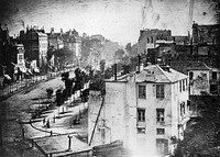 Boulevard du Temple, Paris, 3rd arrondissement, Daguerreotype. Made in 1838 by inventor Louis Daguerre, this is believed to be the earliest photograph showing a living person. It is a view of a busy street, but because the exposure lasted for 4 to 5 minutes (seeshutter speed Daguerre photo explained) the moving traffic left no trace. Only the two men near the bottom left corner, one apparently having his boots polished by the other, stayed in one place long enough to be visible. As with most daguerreotypes, the image is a mirror image.