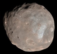 Color image of Phobos, imaged by the Mars Reconnaissance Orbiter on 23 March 2008.The High Resolution Imaging Science Experiment (HiRISE) camera on NASA's Mars Reconnaissance Orbiter took two images of the larger of Mars' two moons, Phobos, within 10 minutes of each other on 23 March 2008. This is the first, taken from a distance of about 6,800 kilometers (about 4,200 miles). It is presented in color by combining data from the camera's blue-green, red, and near-infrared channels.The illuminated part of Phobos seen in the images is about 21 kilometers (13 miles) across. The most prominent feature in the images is the large crater Stickney in the lower right. With a diameter of 9 kilometers (5.6 miles), it is the largest feature on Phobos.The color data accentuate details not apparent in black-and-white images. For example, materials near the rim of Stickney appear bluer than the rest of Phobos. Based on analogy with materials on our own moon, this could mean this surface is fresher, and therefore younger, than other parts of Phobos.A series of troughs and crater chains is obvious on other parts of the moon. Although many appear radial to Stickney in this image, recent studies from the European Space Agency's Mars Express orbiter indicate that they are not related to Stickney. Instead, they may have formed when material ejected from impacts on Mars later collided with Phobos. The lineated textures on the walls of Stickney and other large craters are landslides formed from materials falling into the crater interiors in the weak Phobos gravity (less than one one-thousandth of the gravity on Earth).In the full-resolution version of this image, a pixel encompasses 6.8 meters (22 feet), providing a resolution (smallest visible feature) of about 20 meters (about 65 feet). The image is in the HiRISE catalog as PSP_007769_9010.NASA's Jet Propulsion Laboratory, a division of the California Institute of Technology in Pasadena, manages the Mars Reconnaissance Orbiter for NASA's Science Mission Directorate, Washington. Lockheed Martin Space Systems, Denver, is the prime contractor for the project and built the spacecraft. The High Resolution Imaging Science Experiment is operated by the University of Arizona, Tucson, and the instrument was built by Ball Aerospace & Technologies Corp., Boulder, Colo.