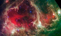 From the source site, courtesy of NASA/JPL-Caltech: Generations of stars can be seen in this new infrared portrait from NASA's Spitzer Space Telescope. In this wispy star-forming region, called W5, the oldest stars can be seen as blue dots in the centers of the two hollow cavities (other blue dots are background and foreground stars not associated with the region). Younger stars line the rims of the cavities, and some can be seen as pink dots at the tips of the elephant-trunk-like pillars. The white knotty areas are where the youngest stars are forming. Red shows heated dust that pervades the region's cavities, while green highlights dense clouds.W5 spans an area of sky equivalent to four full moons and is about 6,500 light-years away in the constellation Cassiopeia. The Spitzer picture was taken over a period of 24 hours.Like other massive star-forming regions, such as Orion and Carina, W5 contains large cavities that were carved out by radiation and winds from the region's most massive stars. According to the theory of triggered star-formation, the carving out of these cavities pushes gas together, causing it to ignite into successive generations of new stars.This image contains some of the best evidence yet for the triggered star-formation theory. Scientists analyzing the photo have been able to show that the ages of the stars become progressively and systematically younger with distance from the center of the cavities.This is a three-color composite showing infrared observations from two Spitzer instruments. Blue represents 3.6-micron light and green shows light of 8 microns, both captured by Spitzer's infrared array camera. Red is 24-micron light detected by Spitzer's multiband imaging photometer.