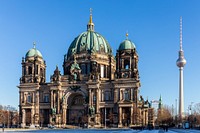 The west front of the Berlin Cathedral with the Fernsehturm (tv tower) next to it.