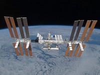 The International Space Station as seen from the departing Space Shuttle Discovery during STS-119. In view are the four pairs of solar arrays mounted along the newly-completed Integrated Truss Structure. The newest and final part of the ITS, launched on this mission, is the S6 truss and arrays, visible to the far left of this image.