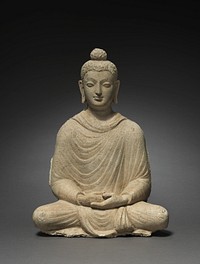 The site of Hadda, now destroyed, had numerous Buddhist stupas. Each was decorated with images of Buddha in niches around the square bases. This Buddha is typical of the seated type, with both feet covered by the robe and hands held gently in the meditation gesture, resting on his lap. The two attendants, one layman in a Central Asian cap and tunic, and one monk bring offerings, probably of fruit, to honor the figure of the Buddha.