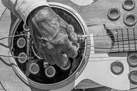 Man playing an acoustic brazilian guitar (Violão) on Marco Zero Square, Refice, Pernambuco, Brazil.Play music of this image