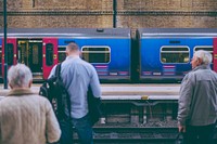 Passengers waiting for trains. View public domain image source here