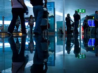 Departing passengers at airport. View public domain image source here