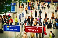 Busy airport, check-in passengers. View public domain image source here