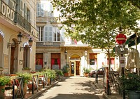 Hotel building architecture, small street. View public domain image source here