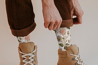 Printed socks mockup man folding up pant leg