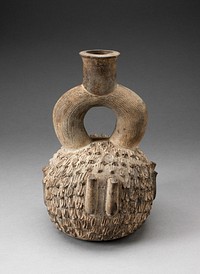 Stirrup Spout Vessel with Raised Appliques Covering the Surface by Cupisnique