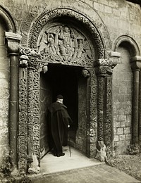 Ely Cathedral: Prior's Door, with Bedesman by Frederick H. Evans