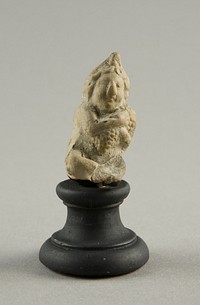 Figurine of a Child Clutching Grapes by Ancient Greek