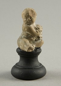 Seated Child Holding Grapes by Ancient Greek