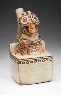 Vessel in the Form of a Seated Ruler with a Pampas Cat by Moche