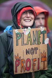 Climate activists bring the message "Insure Our Future" to COP26 in Glasgow, Scotland, UK, on 6th Nov 2021.