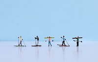 Miniature skiers, extreme sport advertising.