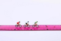 Ruler cyclists, miniature sport advertising.