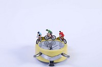 Cyclists on a yellow alarm clock 