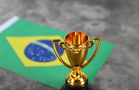 Golden trophy with flag of Brasil 