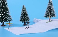 Miniature snow skiers, sport advertising.