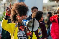 Activists from the Climate Reparations Bloc and Defund Climate Chaos prepare for a march.