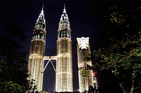 Petronas & Maxis NightviewEvening shot of the twin Petronas Towers and little brother Maxis Tower 212m, Kuala Lumpur, Malaysia