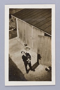 Untitled (Man Looking Up Holding Cat)